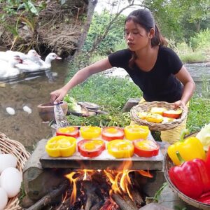 Duck egg grilled in bell peppers on the rock - Survival cooking in jungle