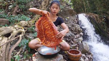 Pork ribs grilled spicy delicious for dinner near waterfall - Survival cooking in jungle