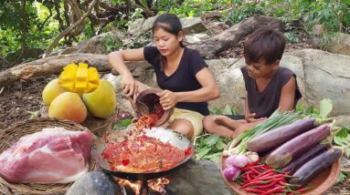 Ripe mango and Pork spicy braised with eggplant for food - Cooking and Eating delicious in jungle