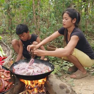 Tasty Cooking Pork intestine and eating delicious with fresh vegetable for jungle food