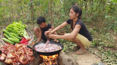 Tasty Cooking Pork intestine and eating delicious with fresh vegetable for jungle food