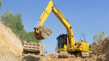 Komatsu PC 130 Excavator Loading Mercedes And Land trucks, Canal Repairing