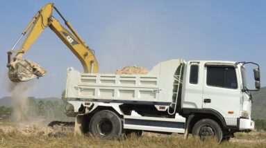 Caterpillar 311B Excavator loading Mercedes And MAN Trucks - Excavator Working In The Field