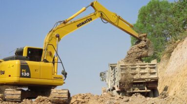 Komatsu PC 130 Excavator Loading Mercedes And MAN Trucks - Canal Repairing
