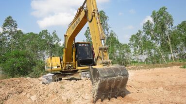 Caterpillar 312B Excavator Loading Mercedes And MAN Trucks - Excavator Working