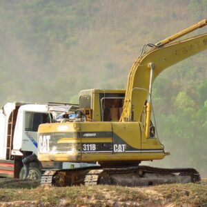 Caterpillar 311B Excavator Loading Mercedes And Man Trucks