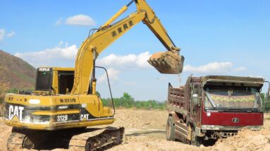 Digging Small Pond Using Caterpillar 312B Excavator And Land Trucks