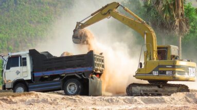 Power Tools! Caterpillar 311B Excavator Working In Dry Season And Land Trucks