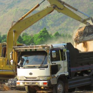 MAN Truck And Caterpillar 311B Excavator Working Mercedes In Dry Season