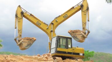 Excavator Caterpillar E120B Dig a Canal Working With Land Trucks, 2024