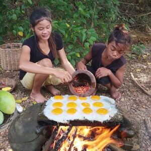 Pick up duck egg and mango fruit for food in forest, Egg grilled on the rock with chili for dinner