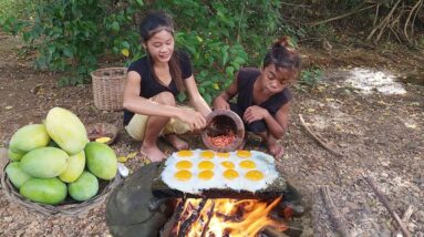 Pick up duck egg and mango fruit for food in forest, Egg grilled on the rock with chili for dinner