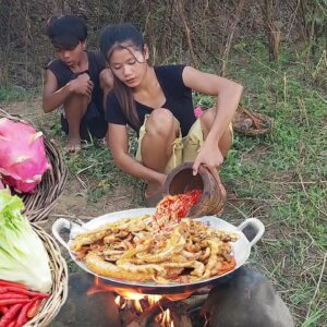 Pork intestine spicy cooking and Dragon fruit for food in forest, Survival cooking