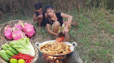 Pork intestine spicy cooking and Dragon fruit for food in forest, Survival cooking