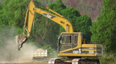 Excavator Loading Mercedes And MAN Trucks \ Power Caterpillar 311B Excavator