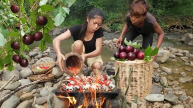 Yummy! Octopus hot spicy chili grilled on the rock so delicious food for dinner, Survival cooking