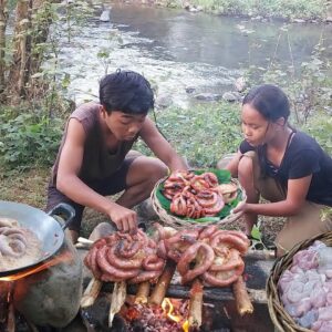 Yummy! Pork intestine spicy braised for food in forest, Eating delicious