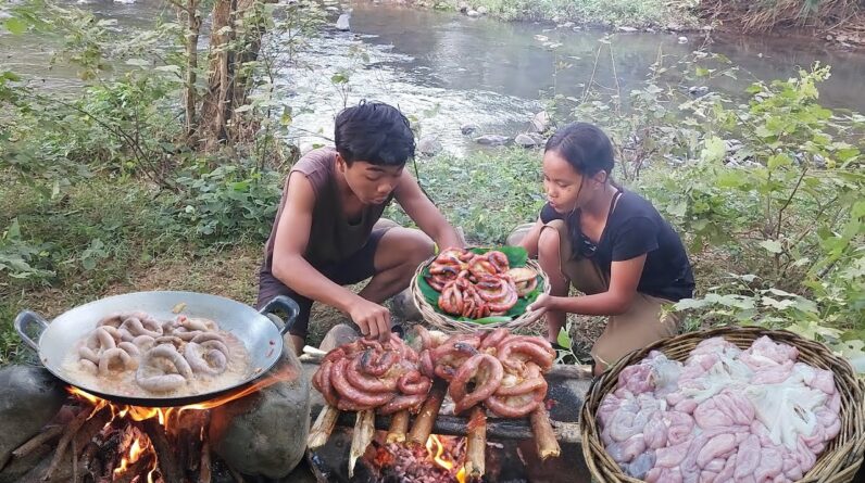 Yummy! Pork intestine spicy braised for food in forest, Eating delicious