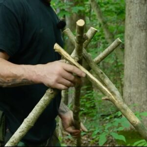 How To Build an Emergency Tripod Tarp Shelter Without Cordage