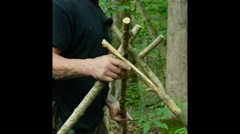 How To Build an Emergency Tripod Tarp Shelter Without Cordage